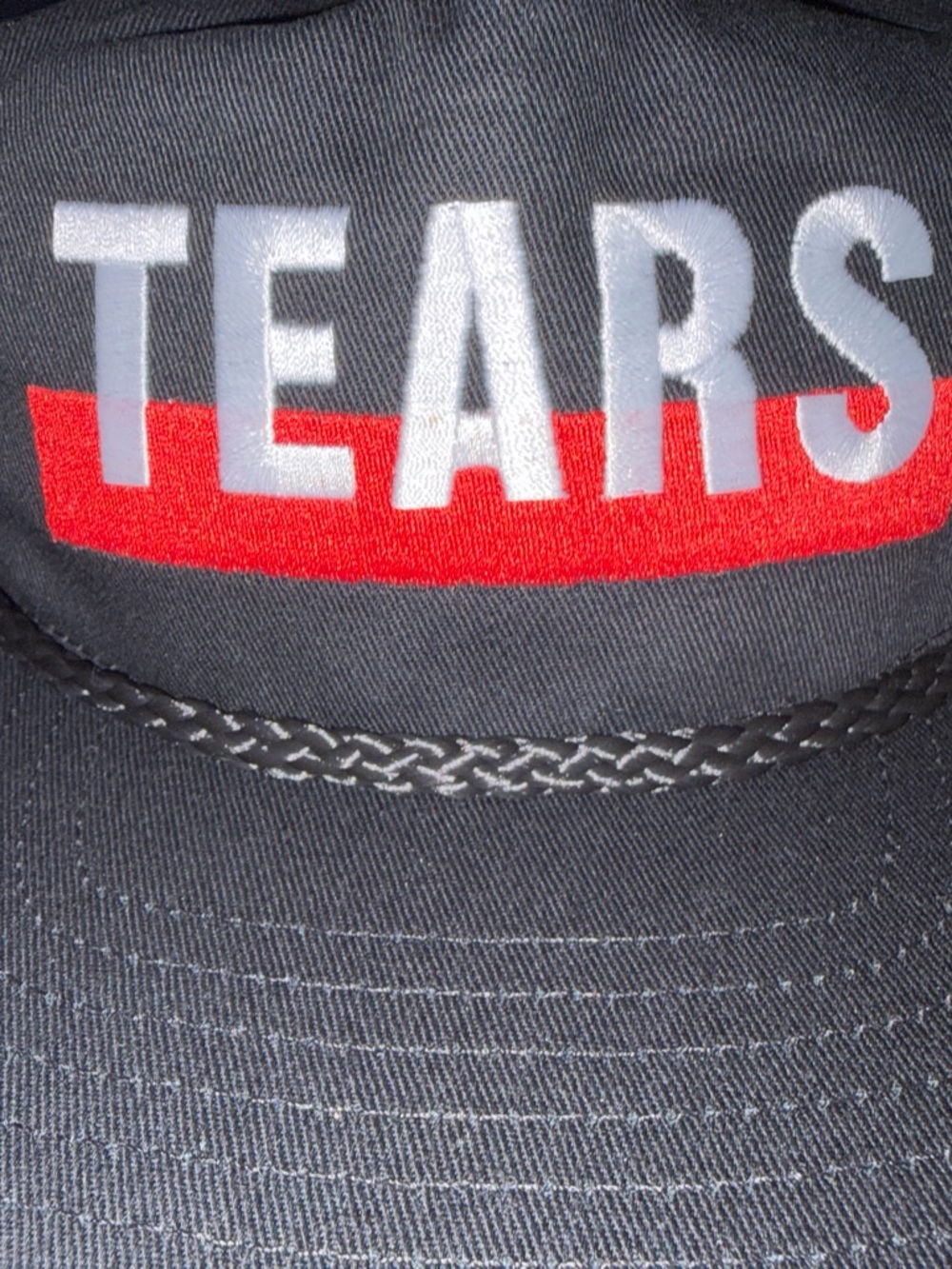 Tears Embroidered Black Trucker Hat with Red Accent